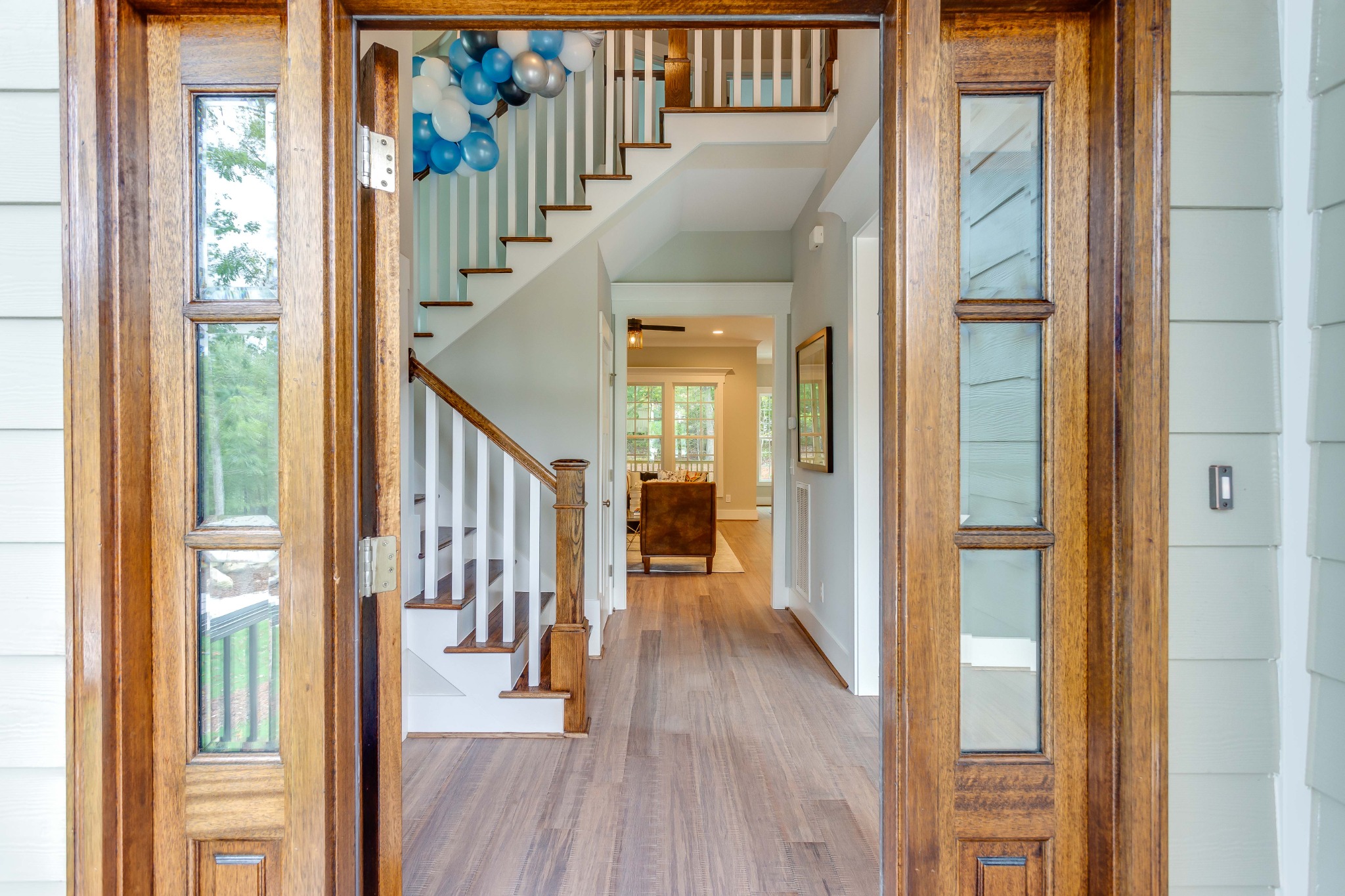 Bright residential entryway with staircase